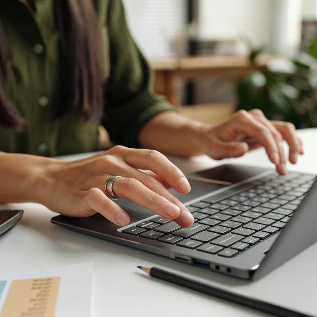 Woman typing on keyboard